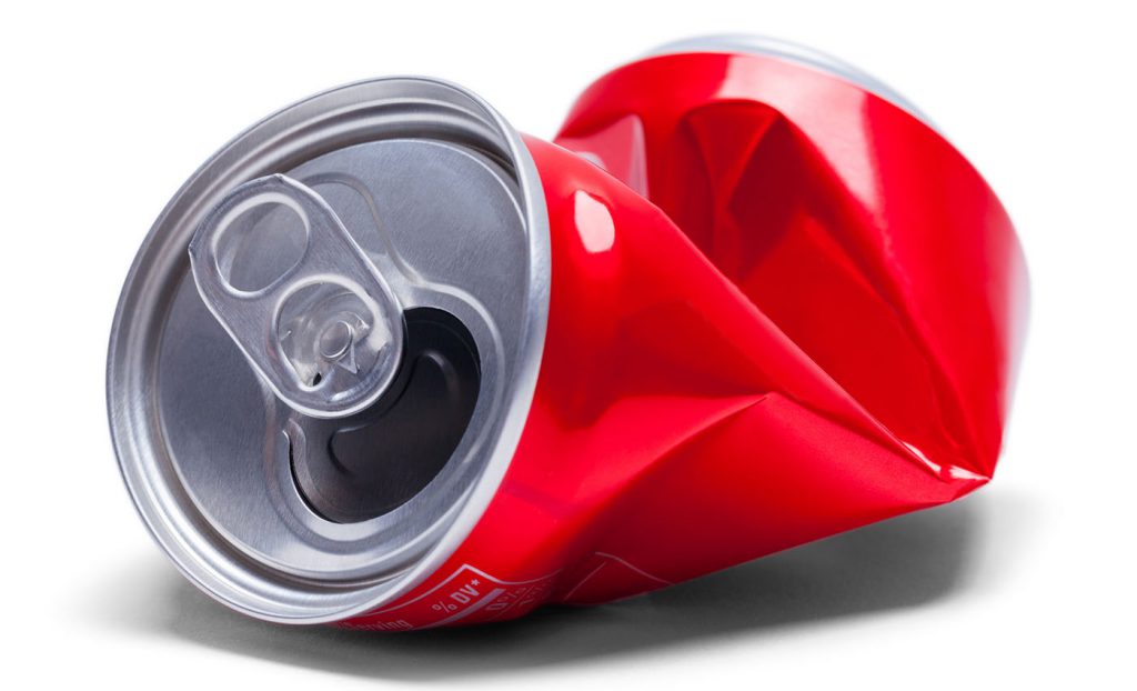 This is a photo of a crumpled soda can