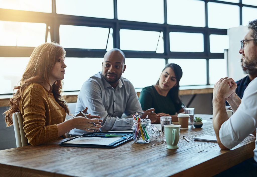 Cropped shot of a group of business colleagues in the office having a meeting