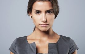 This is a photo of a serious-looking woman