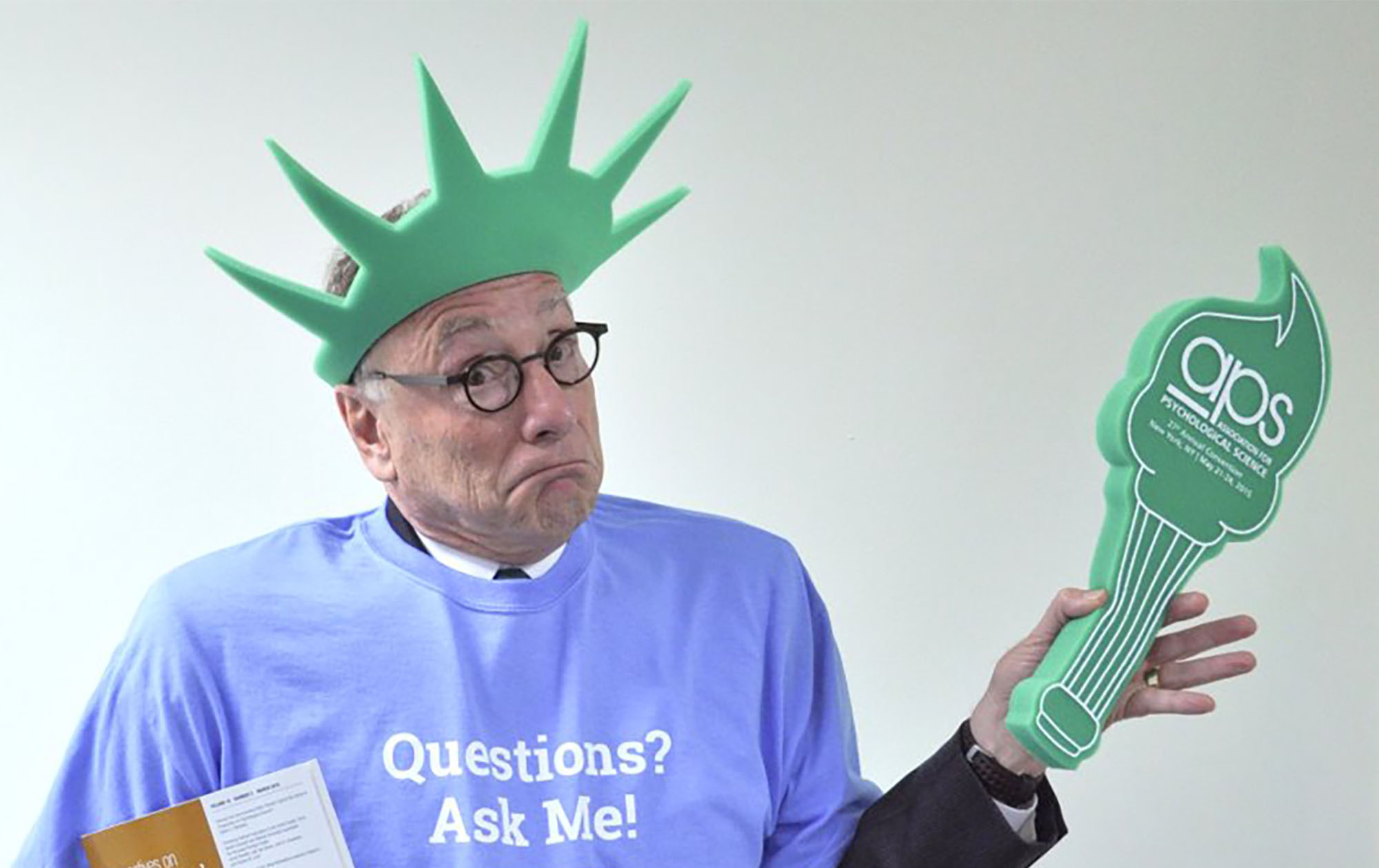 Alan G. Kraut promoting the 2015 APS Annual Convention in NYC, wearing a foam Lady Liberty crown and foam torch.