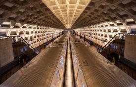 Wide shot of one of DC's metro stations, with two trains at the station.