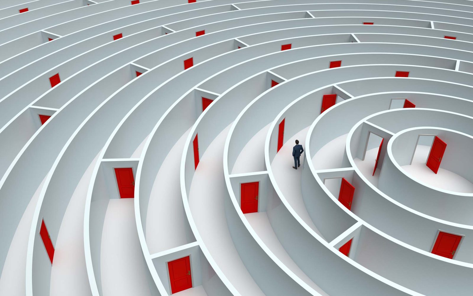 A man is at the center of a white maze that has red doors throughout.