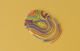 A multicolored fingerprint on a yellow background.