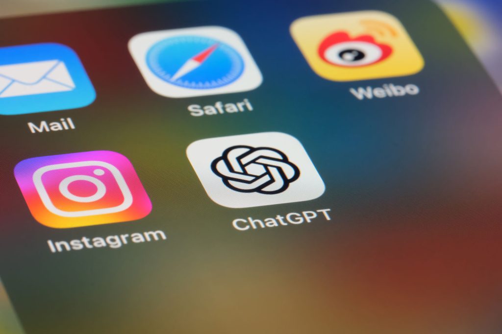 Closeup of an iPhone screen, showing the ChatGPT app, as well as Instagram, Mail, Safari, and Weibo.