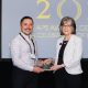 Spence Award recipient Juan Del Toro holds his glass award while standing next to Randi Martin during the Awards Ceremony.