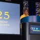 Margaret Beale Spencer stands at an APS 2025 branded podium as she gives her remarks.