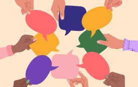Diverse human hands holding speech bubbles.