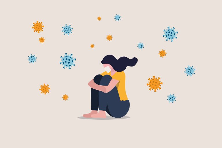 Infographic of a woman sitting alone with COVID-19 viruses floating around her.