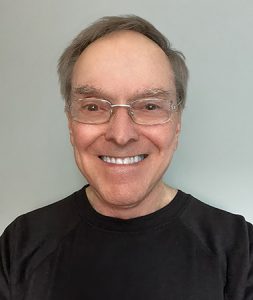 Headshot of John Weisz.
