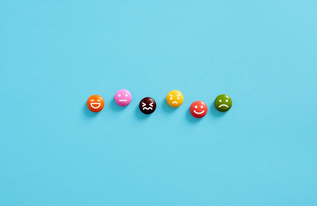 Small emoticons showing different emotions on a blue background.