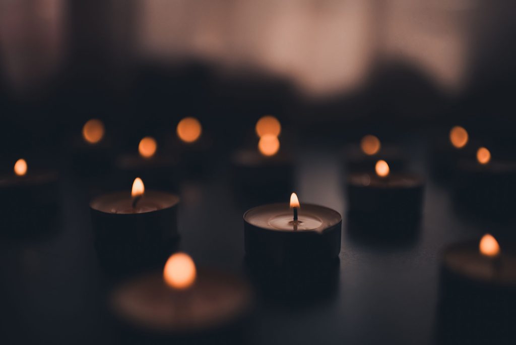 Closeup of memorial candles.