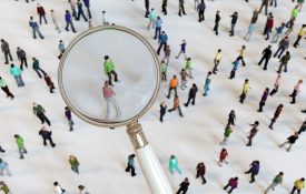 Zoom in with magnifying glass on crowd of people.