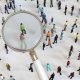 Zoom in with magnifying glass on crowd of people.