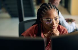 Young woman programmer focused on her work.