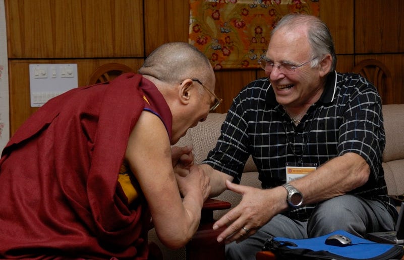 Paul Ekman and HH Dalai Lama laughing together.