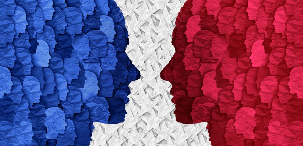 Abstract illustration of red and blue faces looking at each other.