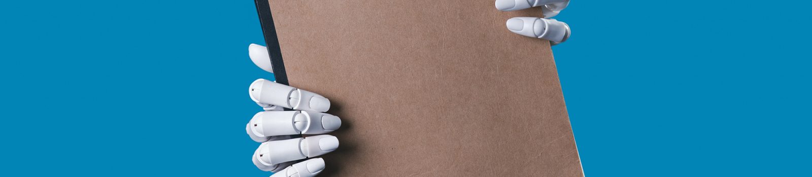 Robot Hands Holding a Blank Brown Notebook