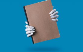 Robot Hands Holding a Blank Brown Notebook