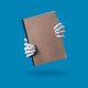 Robot Hands Holding a Blank Brown Notebook