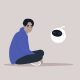 An illustration of a young male character chatting with a chat bot.