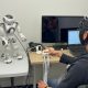 YC playing rock, paper, scissors with a NAO robot while having his brain activity measured using fNIRS.