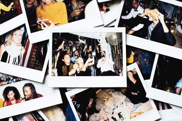 A pile of polaroid photos of a party.