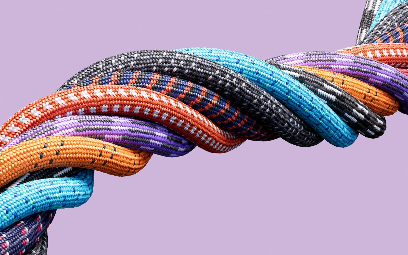 Multicolored ropes bound together to create one large rope.