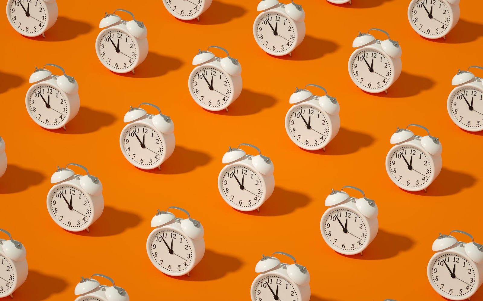 Alarm Clock on Orange Color Background