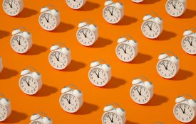 Alarm Clock on Orange Color Background